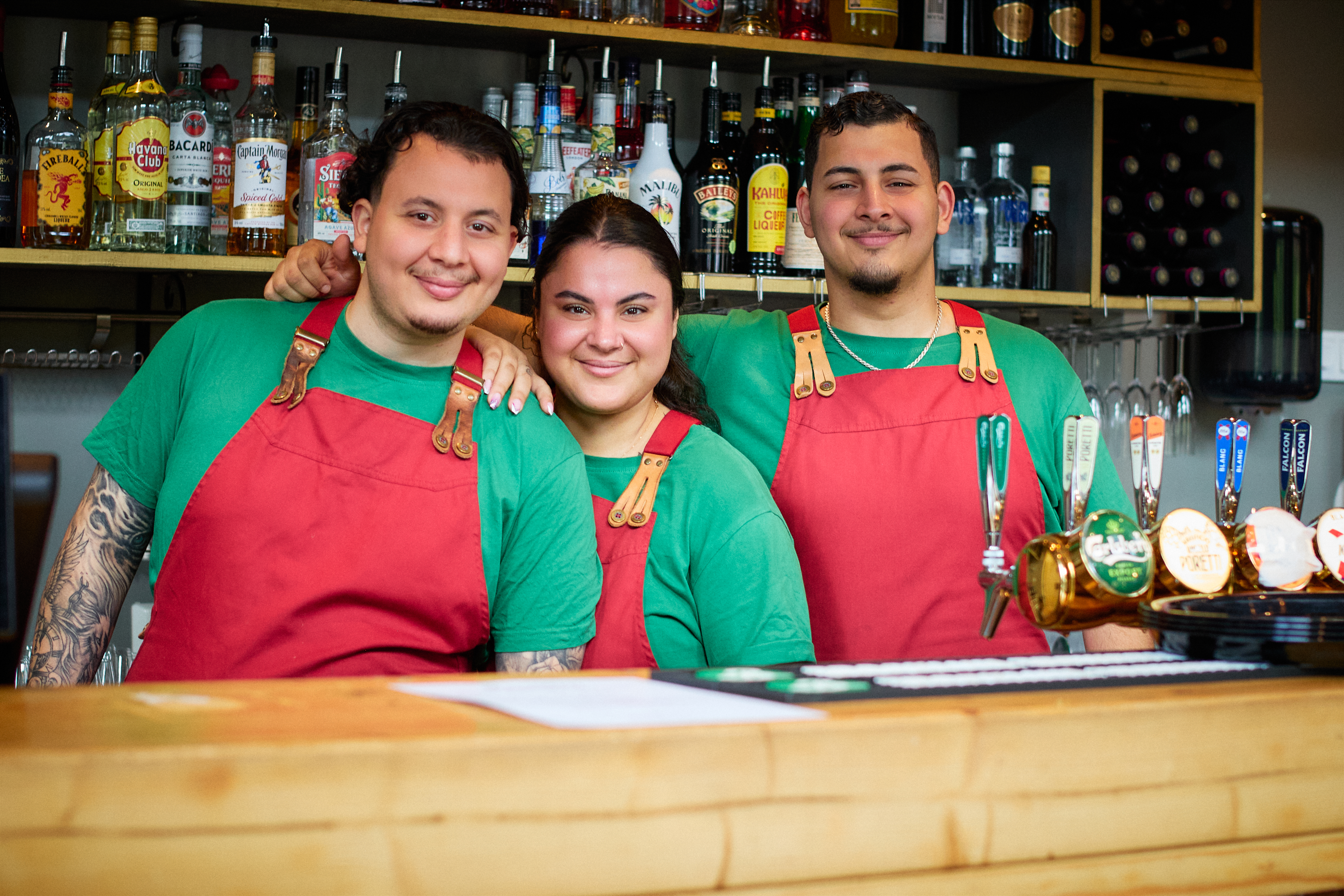 Ahmed, Donja and Hassan behind the bar at Bistrot di Famiglia
